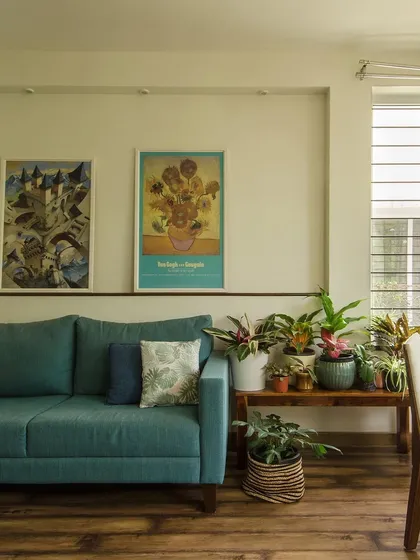 The effect of a green outdoors on an indoor space is profound. The layers of light and shadow from the garden create a porous, breathable quality in this home office, complemented by indoor plants.