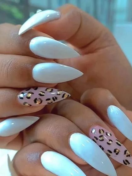 Another view of the stylish white and leopard print stiletto nails.