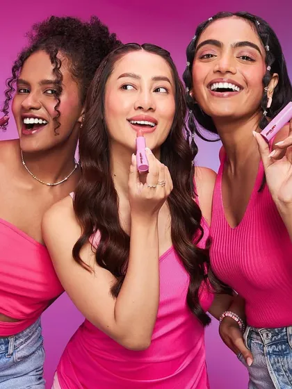 Three models showcasing a range of pink-toned makeup looks. From soft blush to bold lipstick, this image demonstrates my ability to create harmonious and appealing looks for a beauty campaign.