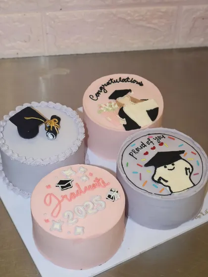 The perfect way to say congratulations to the class of 2025. This set of four graduation-themed lunchbox cakes includes custom illustrations and messages.