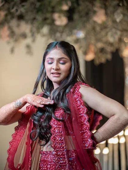 The bride performing during the Sangeet. I capture the movement and expression of dance performances, preserving the energy of the night.