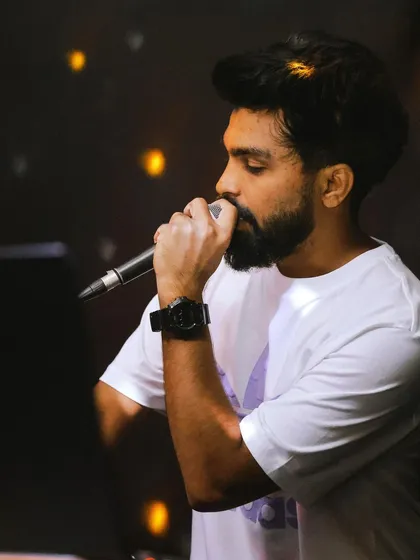 A close-up, artistic shot of me on the mic. The focus is on the passion and emotion I put into every performance.