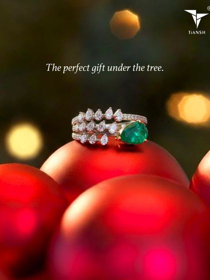 The perfect gift under the tree. This stunning ring, with its vibrant emerald and cascading diamonds, is a gift that will be worn for a lifetime.