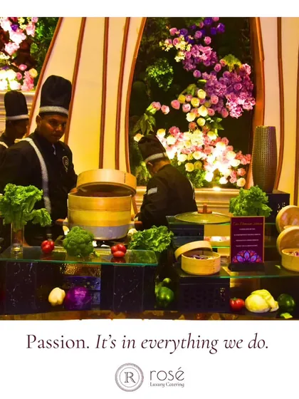 Our chefs at a live dim sum station set against a beautiful floral backdrop. Passion is in everything we do, and we are dedicated to making your events more scrumptious than ever.
