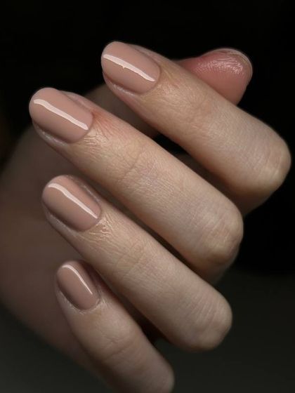A sophisticated taupe-nude manicure. This perfect neutral shade is chic, modern, and versatile.