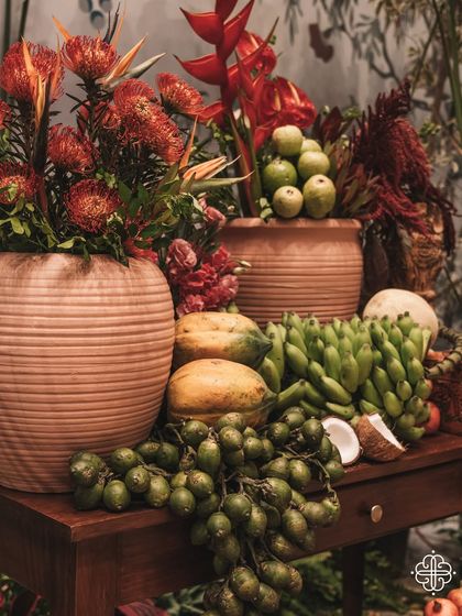 A still life of fruits and flowers from the 'Orchard of Life' event, symbolizing abundance and new beginnings.
