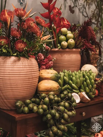 A still life of fruits and flowers from the 'Orchard of Life' event, symbolizing abundance and new beginnings.