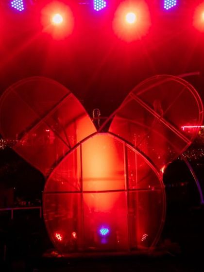 A Mickey Mouse-shaped structure lit in red, part of the fun and quirky props we sourced for the after-party.