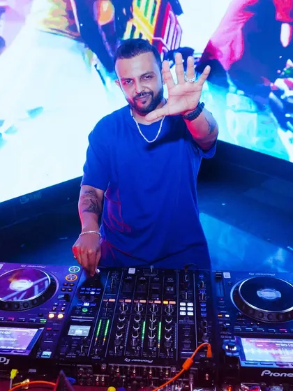The man behind the mask. Even during a themed night, I'm in full control of the console, delivering a seamless musical experience while keeping the party's narrative alive.
