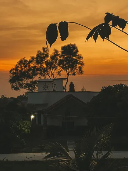 This is a duplicate of image 59. The ashram at dusk, a symbol of the peace and tranquility that awaits you here.