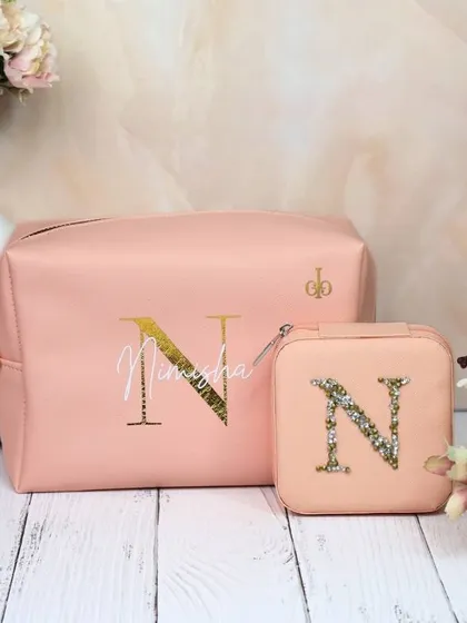 Our personalized jewelry organizer and utility pouch combo in a soft peach color. The pouch is customized with a name and initial, while the jewelry box features a matching chenille patch.