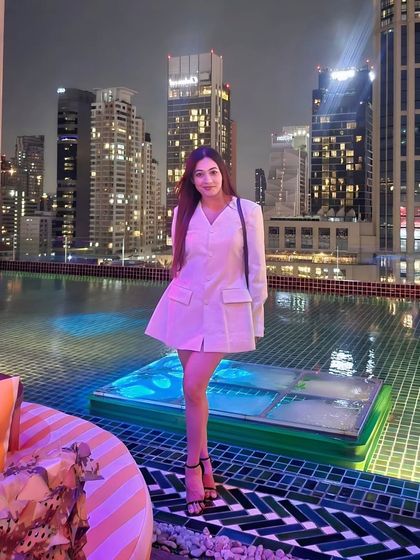 A stylish white blazer dress for a night out in Bangkok. Even when I'm not on stage, my style is modern, chic, and confident.