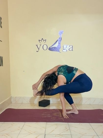 Another variation of a twisting balance pose, this one in a squat. These poses are great for building focus and stability.