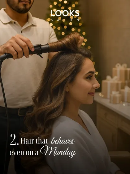Getting a client ready for a Christmas event. Here, my stylist uses a curling iron to create soft, voluminous waves, a classic look that behaves perfectly for any party.