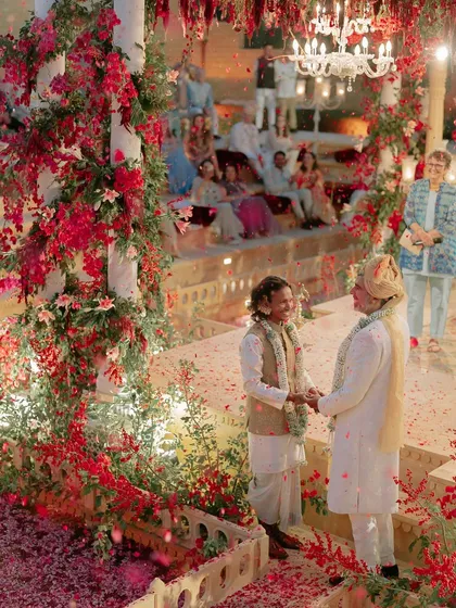 For Kahran and Gourav's Vogue-featured wedding, we designed this breathtaking mandap, using monochromatic red florals to create a powerful contrast against the Jaisalmer sandstone. This ceremony was a testament to their story, blending tradition with a bold, modern vision.