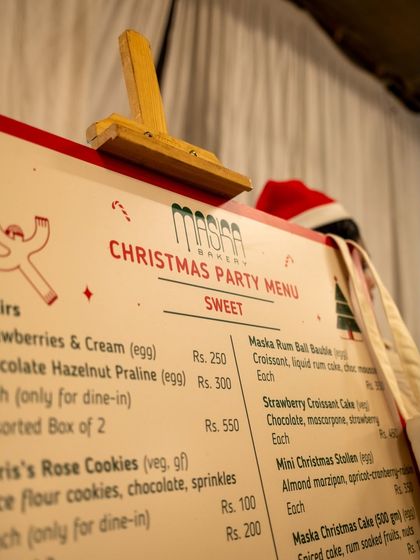 Our Christmas Party Menu on display at a pop-up. We love creating special menus for these events, offering unique treats you can only get for a limited time.