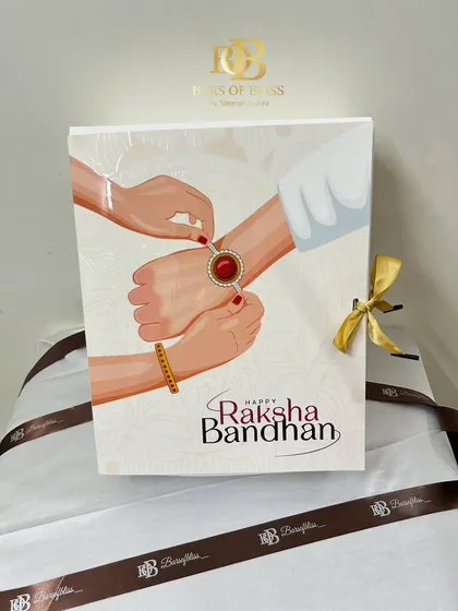 The front of the illustrated Raksha Bandhan hamper box, a beautiful and festive packaging choice.