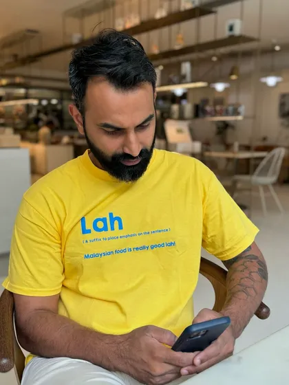 My husband Vinesh, looking very much the part in his "Lah" t-shirt. It's a fun nod to the Malaysian slang that inspired our restaurant's name.