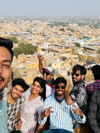 A group selfie from the top of Jaisalmer Fort, capturing the fun and the stunning cityscape.