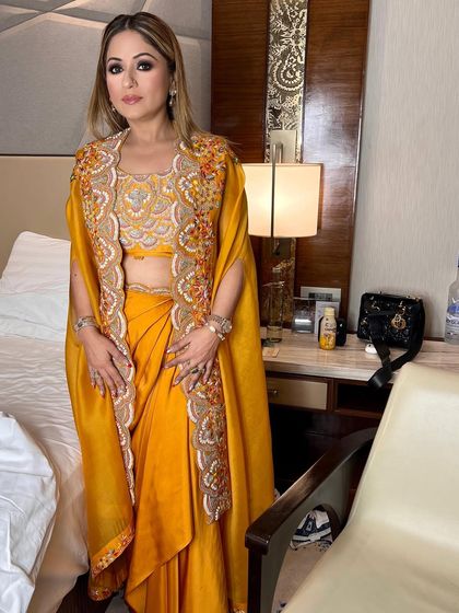 The full look for Naazi, looking absolutely glamorous in her yellow embroidered outfit.