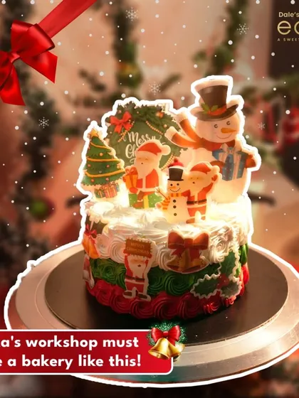 Santa's workshop must have a bakery like this! This fun Christmas cake is adorned with edible figures of Santa, a snowman, and a Christmas tree, bringing festive cheer to your table.