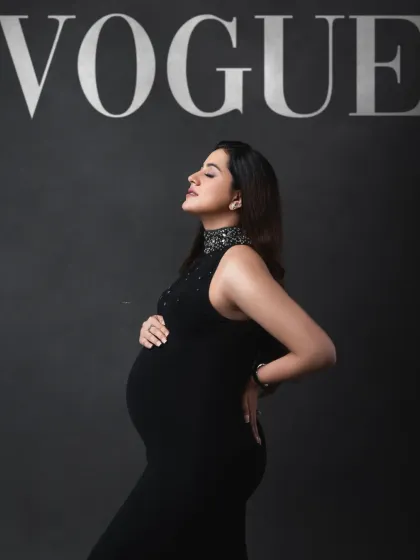 The epitome of pregnancy glamour. This "Vogue" inspired portrait in a sparkling black gown captures the strength and sophistication of the modern mother-to-be.