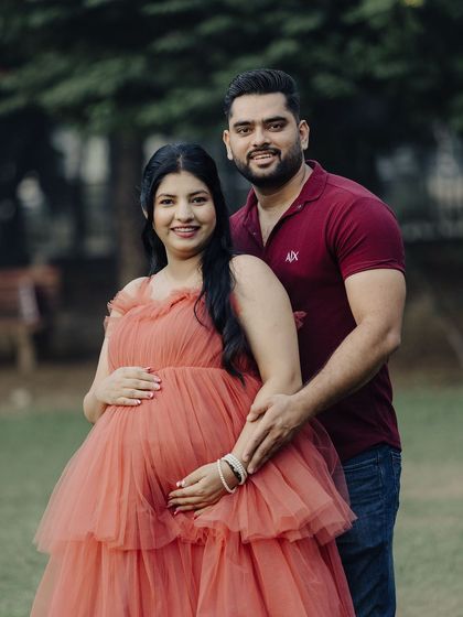 A lovely portrait of the expecting couple. Our gown is designed to be comfortable and flattering, perfect for capturing the beauty of this special time.