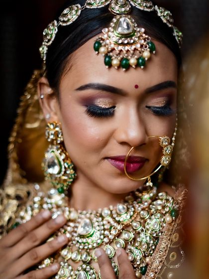 A detailed close-up of the glittery eye makeup and the intricate Kundan jewelry, demonstrating advanced application skills.