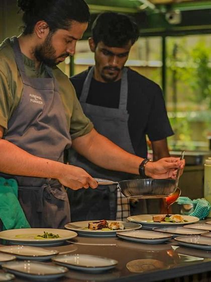 A candid shot of me and my sous chef during a busy service. Teamwork and communication are the backbone of a successful kitchen.