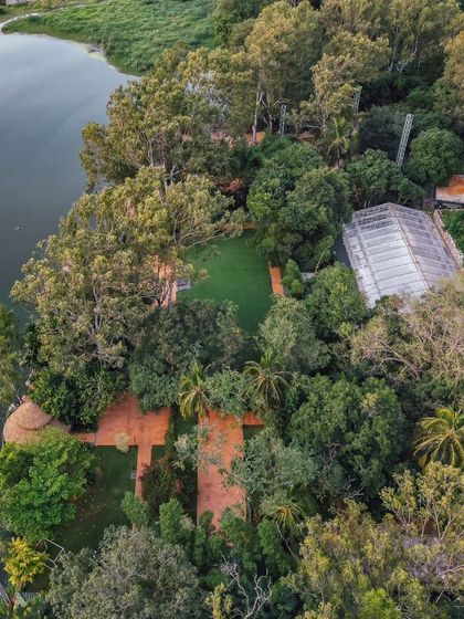 A stunning aerial view of the resort, showing how it's perfectly integrated into the surrounding forest and lake.