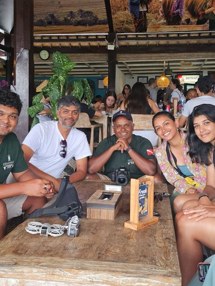 Post-dive discussions in Bali. Sharing photos, identifying fish, and reliving the underwater moments over a meal is a huge part of the experience.