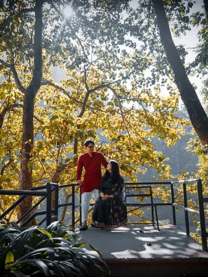 A serene pre-wedding portrait set against a beautiful natural landscape. We use the golden hour light to create a warm and romantic atmosphere for your photos.