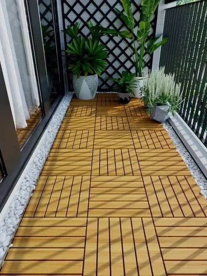 A simple yet elegant solution for any balcony is installing these interlocking wooden deck tiles. They instantly add warmth and a touch of class, creating a clean, durable surface that feels wonderful underfoot and pairs beautifully with plants.