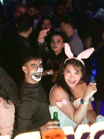 Guests in costume for our Halloween night, including bunny ears and face paint.