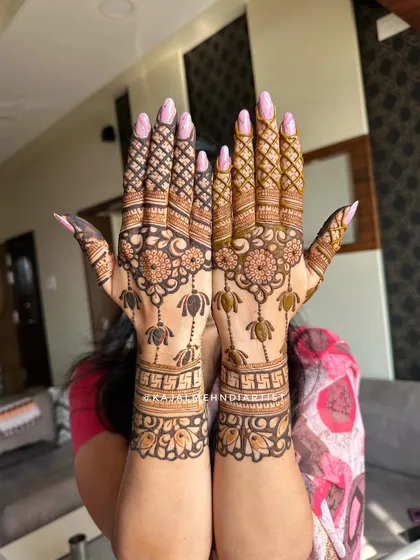 A backhand design with lotus and swastika motifs.