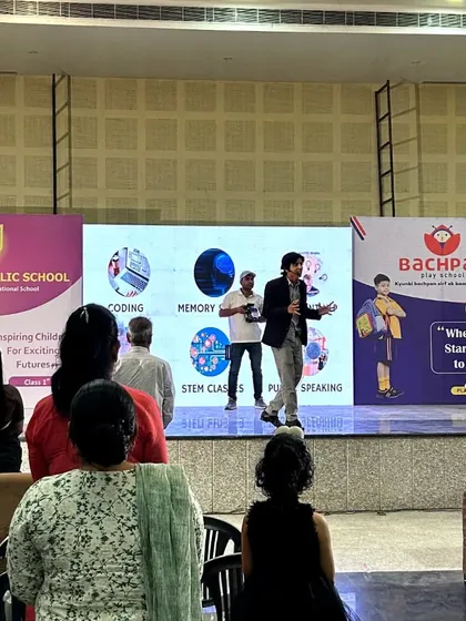 A view from the audience at our Kishangarh seminar. On stage, I am explaining the different skills we teach, including coding, memory, and public speaking, all designed for the future.