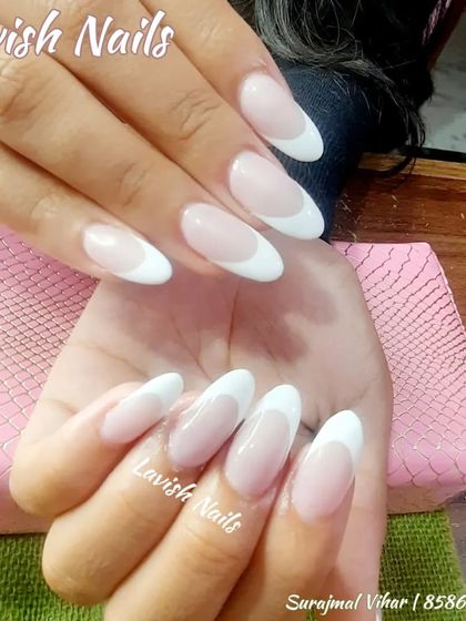 A classic French manicure on almond-shaped nails, showcasing a timeless and polished look.