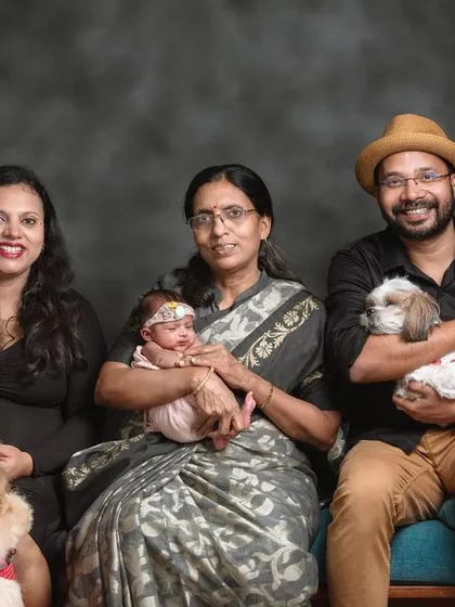 This portrait captures three generations and two furry friends. It shows my ability to manage and pose larger groups, including pets, for a complete and heartwarming multi-generational family photo.