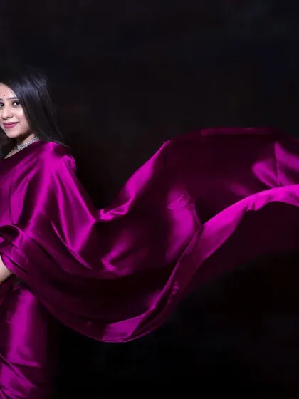For a touch of desi elegance, a satin saree in the studio creates a stunning and dramatic look. The way the fabric flows highlights your beautiful bump with grace and style.