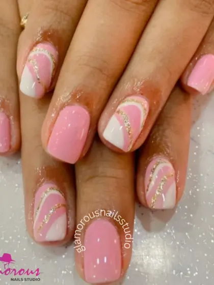 A soft and pretty design in a classic pink, with accent nails featuring a white and gold glitter swirl for a touch of elegance.