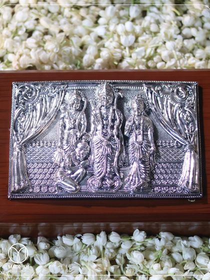 Our Ram Parivar Box, a divine indulgence wrapped in tradition. The centerpiece is a beautifully detailed silver-plated plaque of Ram Parivar, symbolizing love, loyalty, and togetherness.