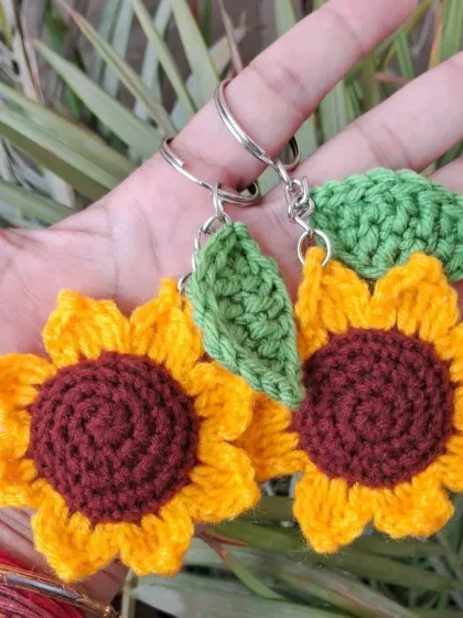 Bright and sunny sunflower crochet keychains. These little tokens of appreciation are handmade with love and are a wonderful way to brighten someone's day.