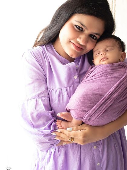 A classic portrait of a mother holding her sleeping newborn. This simple and beautiful shot is a perfect way to remember how tiny they once were.