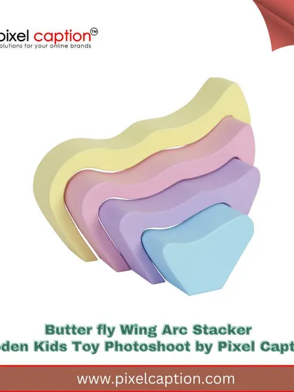 We make kids' toys look fun and inviting. This branded shot of a wooden butterfly wing stacker toy uses vibrant colors and a clean background to appeal to parents shopping online for their children.