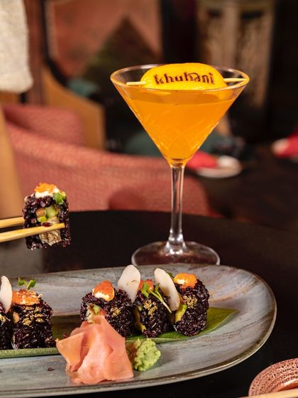 Sushi and cocktails, a perfect pairing. Our black rice sushi with a signature orange cocktail makes for a stylish and delicious lunch break.