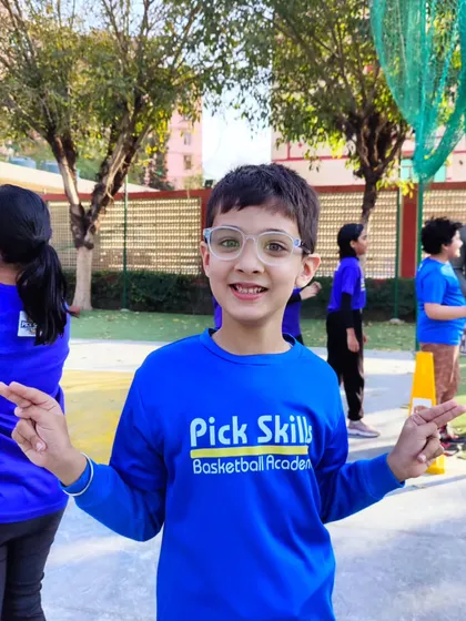A smiling player, happy to be on the court. We combine fitness and fun in every session, ensuring kids stay active and enjoy their basketball journey.