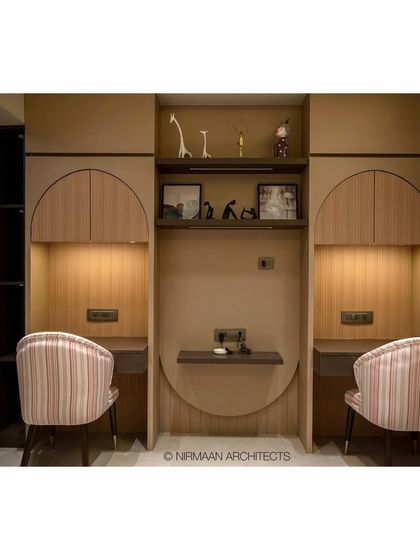Another view of the symmetrical study desks in the Duplex Project's shared bedroom. The design ensures harmony and provides ample storage for both children.