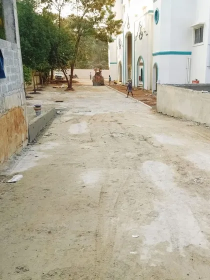 A raw site view showing the path of a future road being prepared.