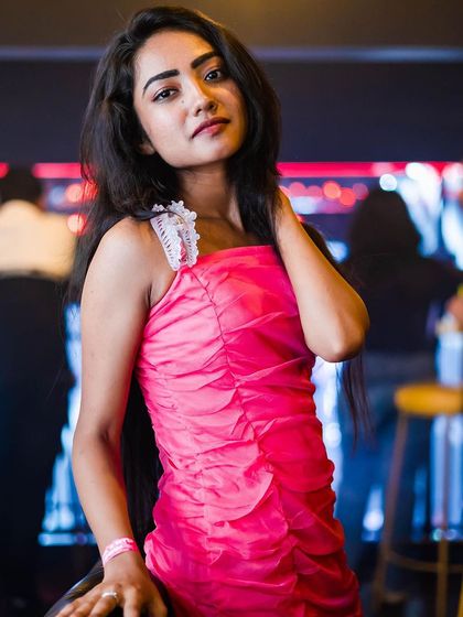 A guest posing at the bar.