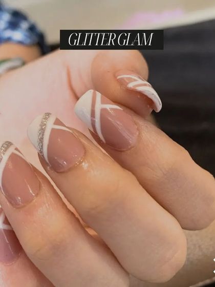 "Glitter Glam" at its finest. This modern French manicure with glitter accents is a chic and sophisticated look taught in our nail craft course.